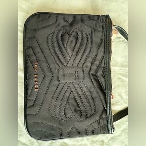 Ted Baker Black Quilted crossbody with Rose Gold metal lettering and zippers.
